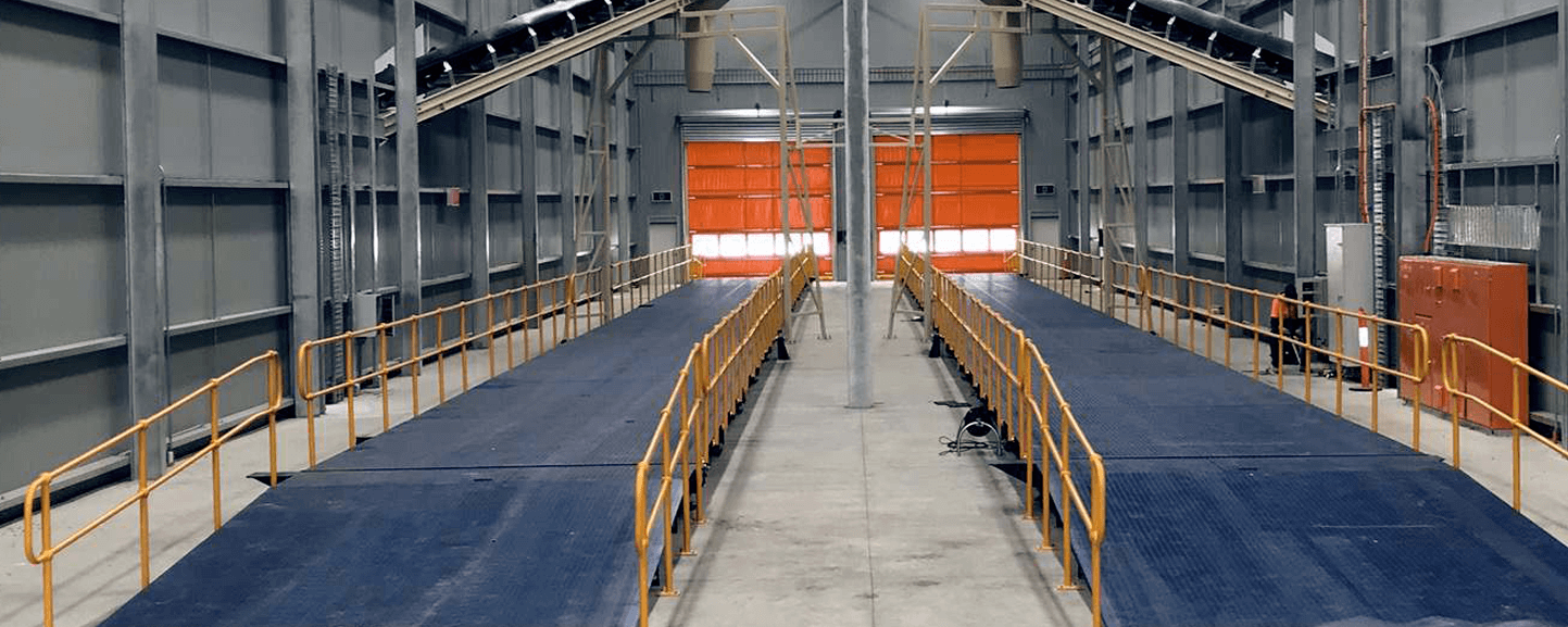 A detailed color image showing a Gendio weighbridge installed on a site, highlighting its robust construction and precise weighing capabilities.